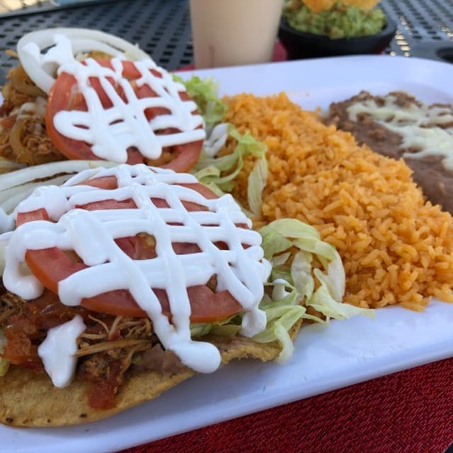 Two Tostadas with Meat & Side of Rice and Beans.