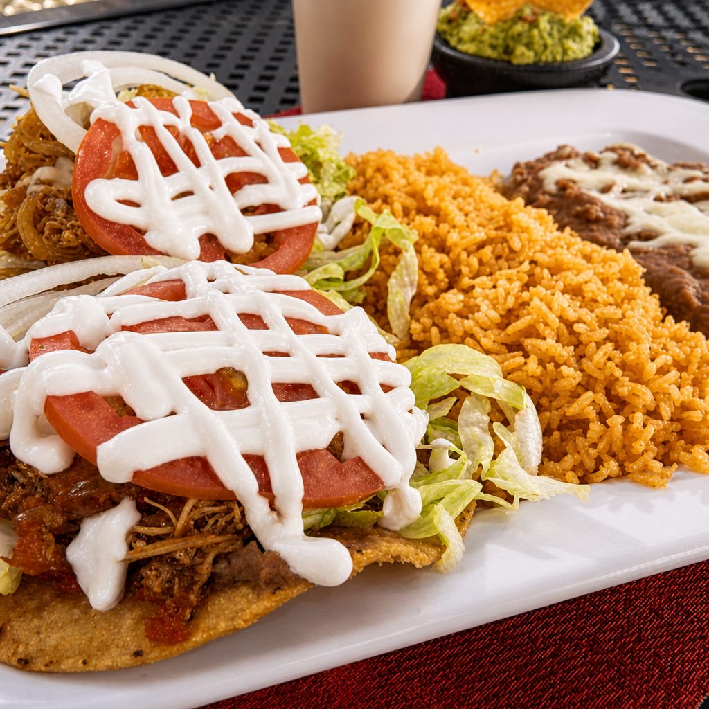 Two Tostadas with Meat & Side of Rice and Beans.